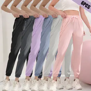 6-pack women’s casual athletic pants made with polyester and spandex, cuffed design, elastic drawstring waist, suitable for outdoor activities, yoga, and hiking. Camping, gym wear, women’s running pants
