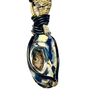 Wire wrapped  natural crystal geode.