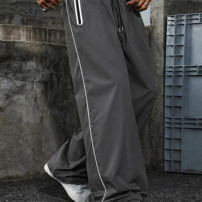 Men's Y2K nylon track pants with side stripes, elastic waistband