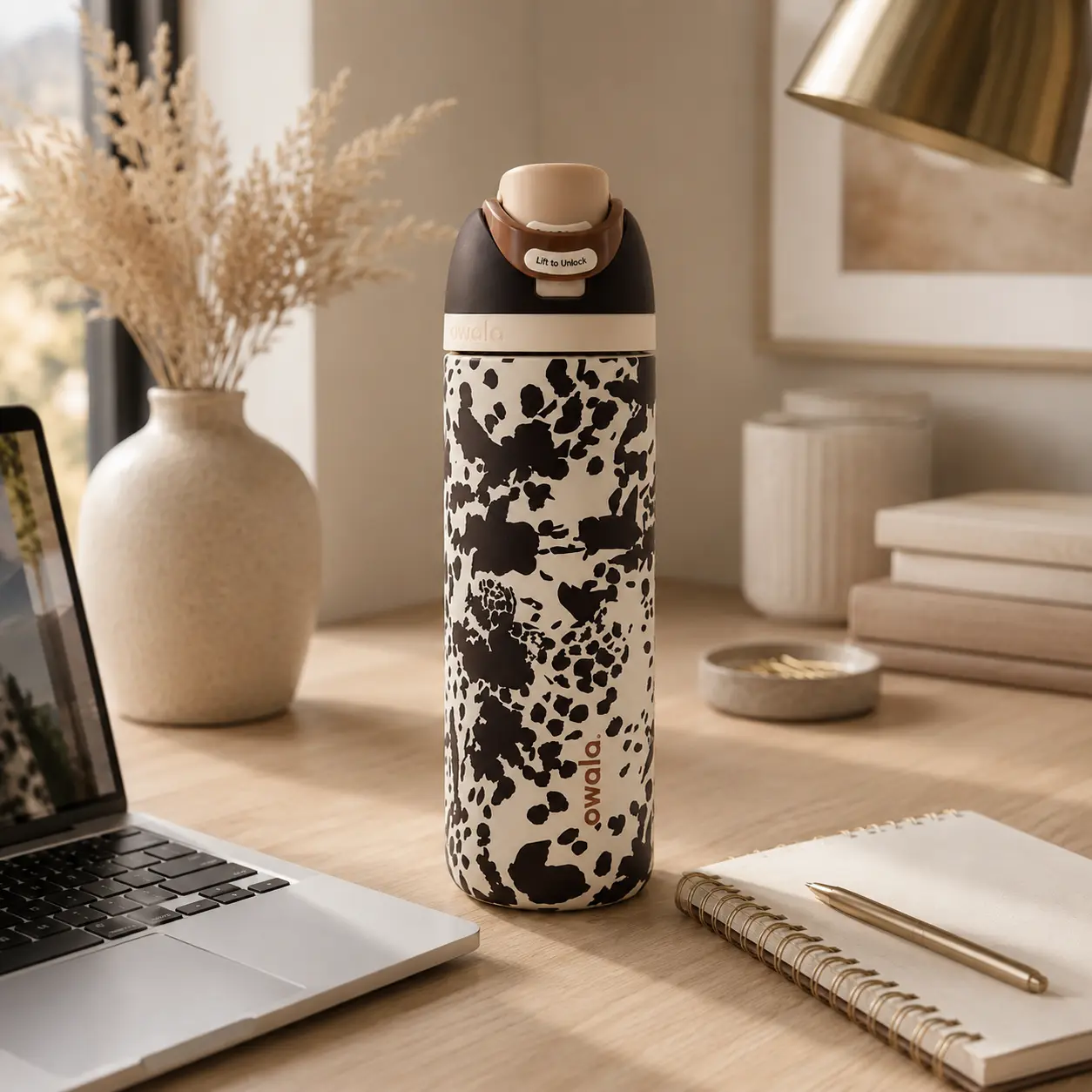 Owala FreeSip Cowgirl Core Special Edition Insulated Water Bottle with Brown and White Cow Print