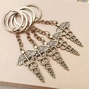 5pcs Dual Snake Staff Medical Symbol Keychains, Car Wallet Backpack Accessories, Stylish and Functional Keychain Set