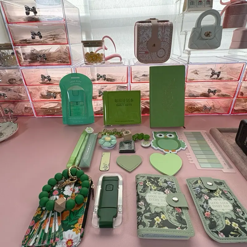 Green stationery and jewelry