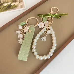 Lily of the Valley Keychain Set – Green Leather and Pearl Pendant Keyring, Women's Floral Bow Keychain, Cute Car and Bag Accessory, Birthday Gift, Mother's Day Gift