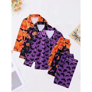 Women’s Halloween-themed pajama set featuring a pumpkin lantern, bat, spider, and other prints on long-sleeved top and pants with lapel buttons, suitable for family leisure, comfort, and holiday sleepwear.