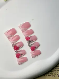 🎄 Pink Base Medium Flat Nails Adorned with Christmas Heart Bow Design