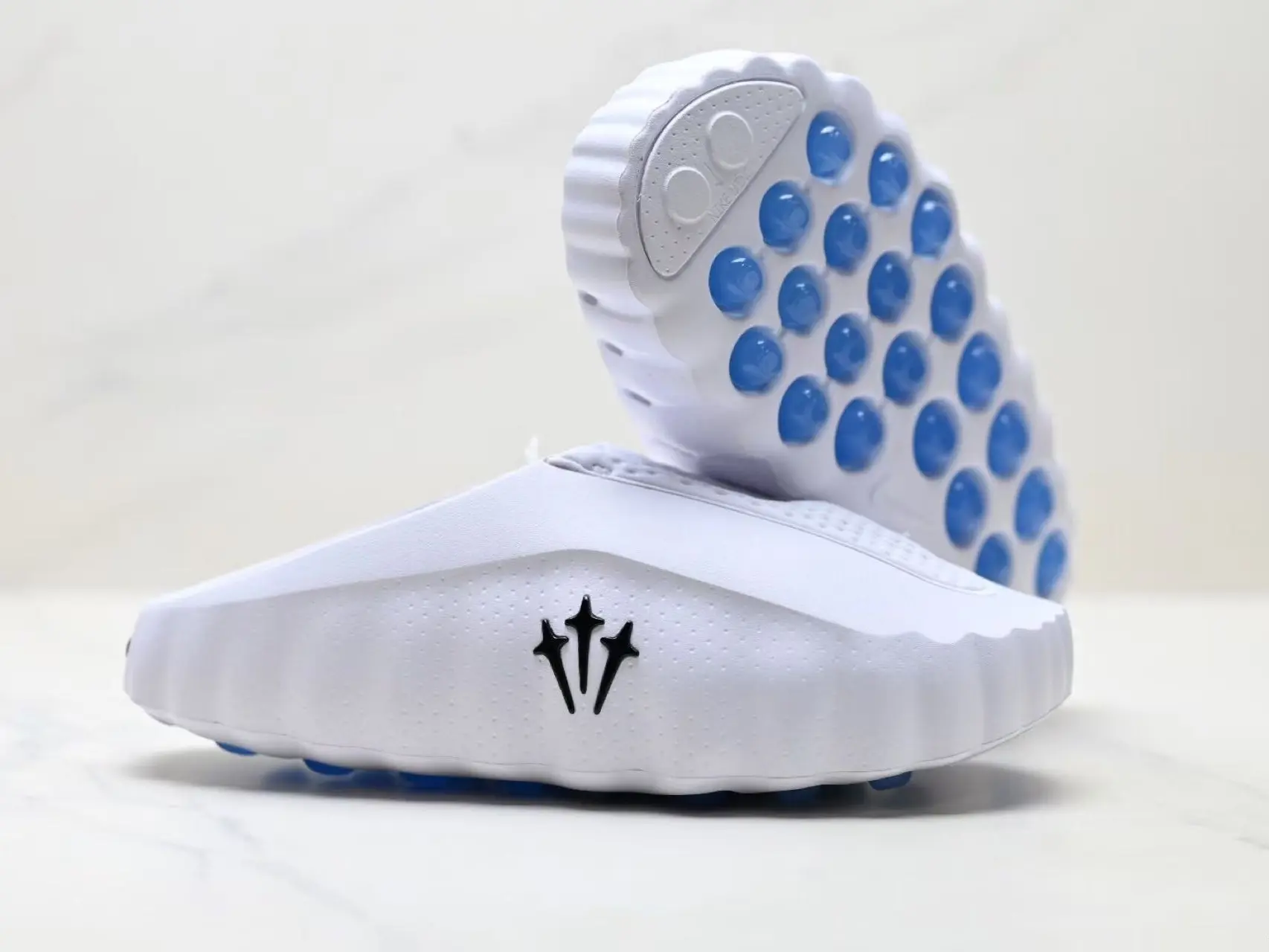Solid White Perforated EVA Slip On Athletic Slides, Black Triple Star Embossed Logo Contrast Bright Blue Raised Stud Anti-Slip Outsole Quick Dry Gym Shower Unisex Recovery Sandals