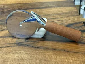 Handmade sapele pizza cutter