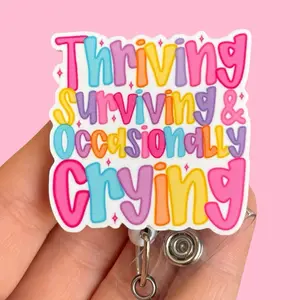 Glitter My Badge Thriving surviving and occasionally crying. badge reel for nurse and hospital workers. Badge clip Badge pull - Retractable swivel clip with a 360 rotation. Great gift for coworker