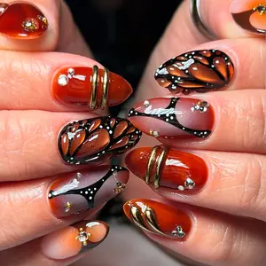 24pcs almond nails pacrylic press on nails perfect for New Year's and eye-catching occasions, Nail art design, 3D black and red butterfly patterns, white diamond embellishments, orange red gradient French tip nails