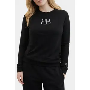 LS Logo Fit: Slim Junior Fit a light-weight black fabric and a, over size, center-chest printed logo
