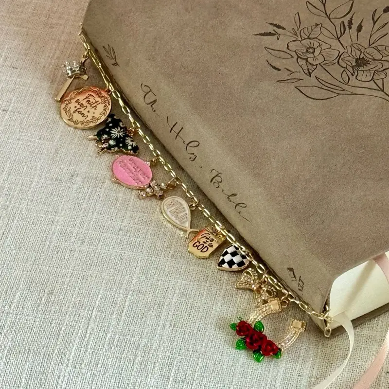 PLEASE READ- Bible Charm Chain - Faith Over Fear with meaningful Charms/Gold Tone **Butterly Pattern may vary** Prayer warrior charm is out of stock. JESUS SAVES charm in place of prayer warrior. Please see pictures before ordering.