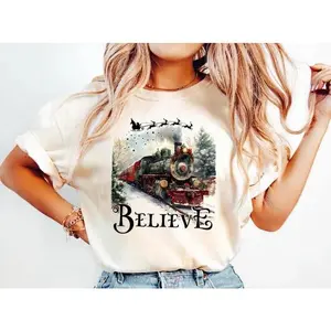 Believe Train Christmas Shirt, Polar Express Inspired Tee, Holiday Train T-Shirt, Christmas Spirit Graphic Tee, Festive Red Xmas Shirt