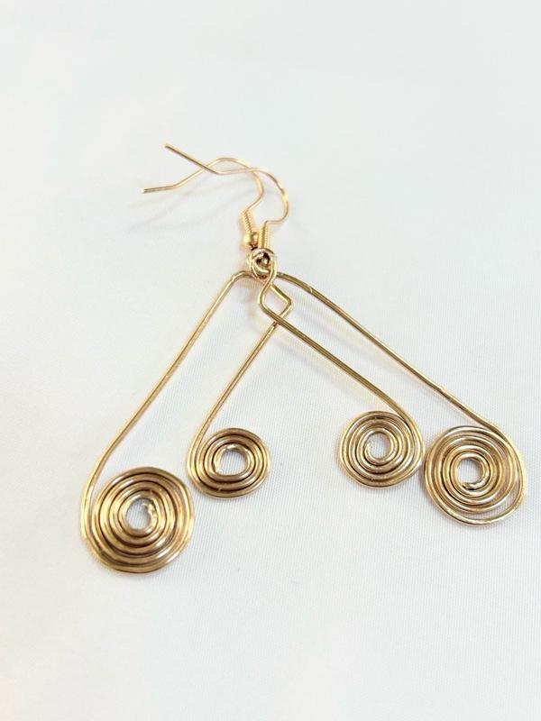 SCS-MTER-002 Golden Metal Echo 2” Earrings with Spiral Design and Hook Closure