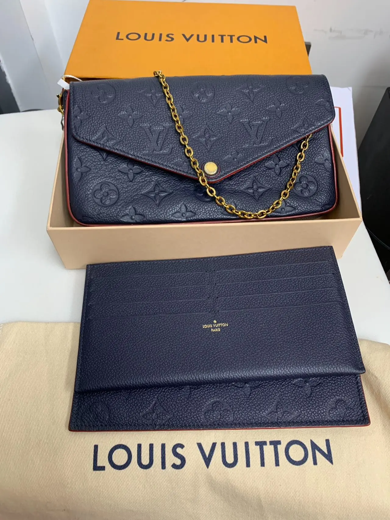 Pre-owned Louis Vuitton leather Clutches & Wristlets Pochette Felicie Monogram Empreinte Navy/Marine Rouge XP01963