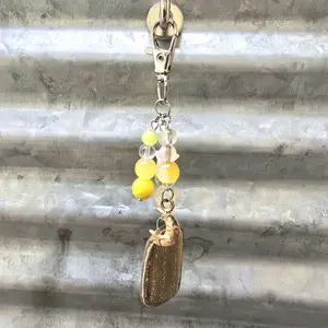 Keychain with a Petrified Wood Stone Pendant, Yellow Beads and Gold Color Moon Charm