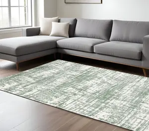 HomeRoots 575076 7 x 10 ft. Abstract Rectangle Area Rug, Green & Ivory