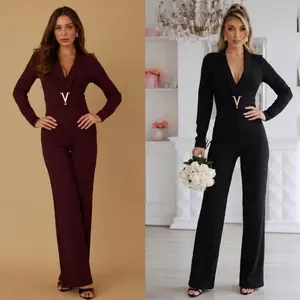 LONG SLEEVE JUMPSUIT - METALLIC V DETAIL ON WAISTBAND - COLLAR LONG FLAP DOWN NECKLINE - DEEP V POINT NECKLINE - LONG SLEEVE - FLARE - ZIPPER ON THE BACK