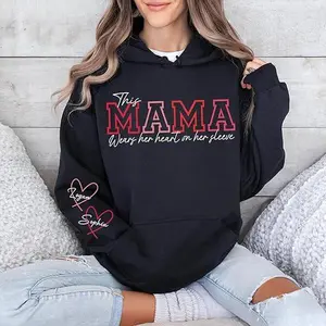 Personalized This Mama Wears Her Heart on Her Sleeve Hoodie, Custom Mama Shirt with Kid Names on Sleeve, Gift for Mom, Mother's Day Shirt, Mom To Be