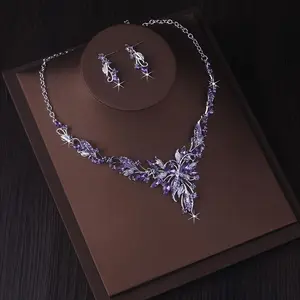 A high-end and atmospheric necklace+a pair of earrings set in purple, blue, and red. Bridal jewelry, wedding dress, evening party accessories