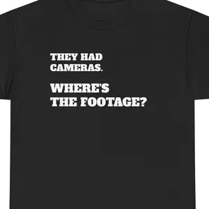THEY HAD CAMERAS. WHERE’S THE FOOTAGE? – Bold Conspiracy Shirt | Viral Protest Tee | Unisex Heavy Cotton