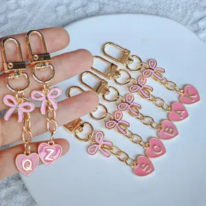 A Stylish Pink Bow And Heart Letter Enamel Keychain, Featuring 26 Alloy Key Rings from A to Z, Perfect for Fashionable And Romantic Women And, Making It an Ideal Small Gift for Birthdays And Holidays, Cute Charms Keychain