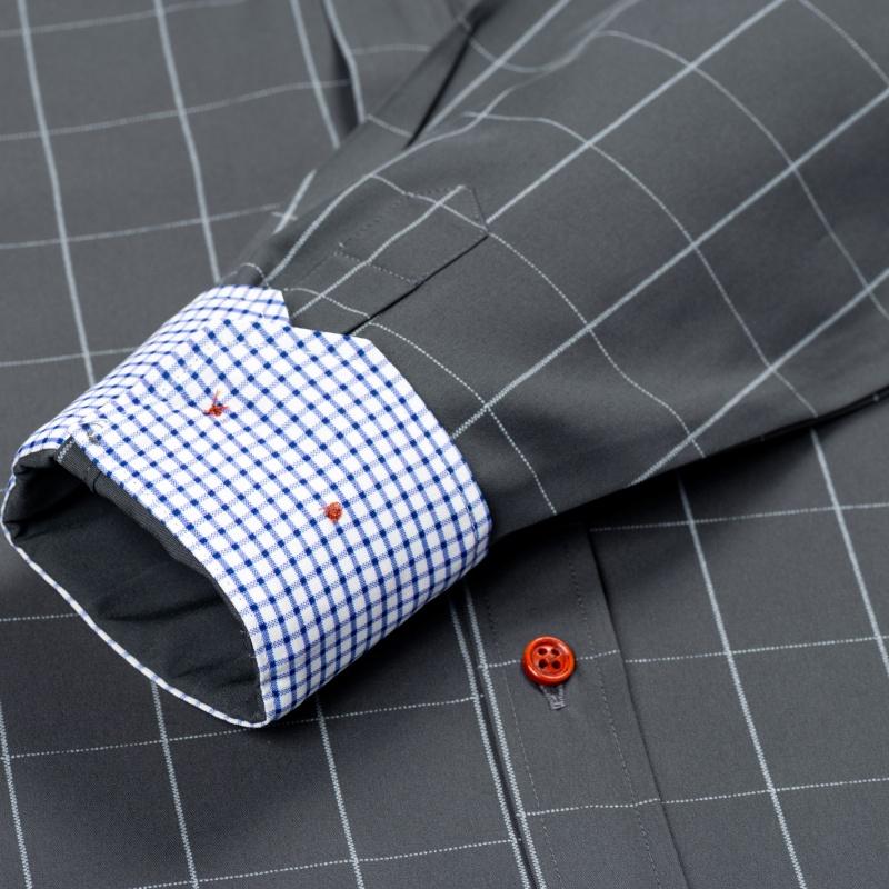 Men’s long-sleeve shirt with four plaid color-block panels, business-casual style. Button-down notched collar design for a sharp look, red buttons add refined details, blue-and-white plaid interior provides visual depth. Long-sleeve fit suitable for multi
