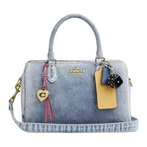 COACH Rowan 25 Crossbody Handbag for Women, Denim Style with Logo Charm, Light Indigo