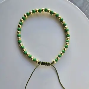 Bello pulso verde y dorado ajustable laminado en oro-Beautiful green and goldplated adjustable bracelet
