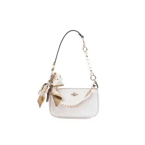 COACH Nolita Small White Handbag with Metal Logo Zipper and Simple Lettering Design