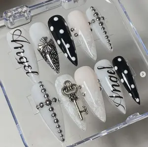 Elegant and Chic Nail Art: 'Angel' Script, Polka Dots, Keys, Crosses, and Metallic Accents in Black and White