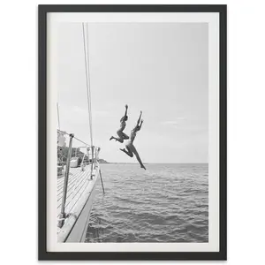 Black and White Coastal Fine Art Print – Women Jumping from Sailboat | Italy Beach Wall Decor for Modern Homes