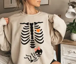Cute Skeleton Baby Girl Pregnancy T-Shirt, Sweatshirt, Hoodie – Funny Halloween Maternity Shirt With Ribs, Heart, And Fetal Skeleton Design For Expecting Moms
