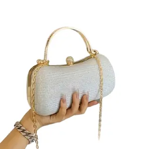 Silver Clutch Bag with Gold Accents, Elegant Design, Adjustable Strap, and Chain Detail