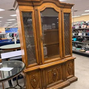 Beautiful Wooden Cabinet with Glass Doors and Carved Details for Elegant Home Decor