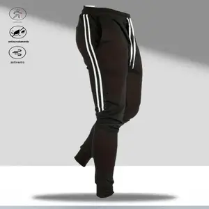 A pair of casual pants with side stripes, featuring a simple outdoor style, drawstring waistband with a minimalist outdoor feel, practical side stripes, perfect for everyday outdoor activities or leisurely outings in the countryside. It can hold items lik