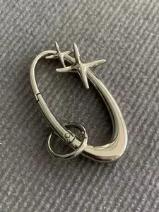 Elegant Oval Starburst Keychain Charm, Stylish Keychain, Trendy Unisex Accessory for Bags & Belts, Unique Cultural Fashion Statement Piece