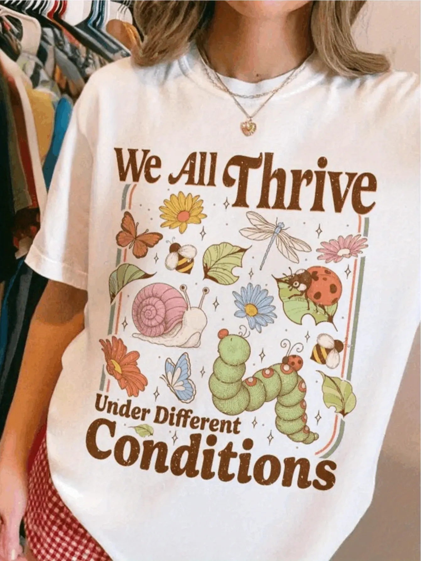 BCBA Neurodiversity T-Shirt | Designed for Special Education Teachers and Mental Health Advocates with "We Thrive in Different Environments" Slogan, Colorful Insect and Floral Pattern, Regular Fit Short Sleeve Casual Top, Hand Wash Only