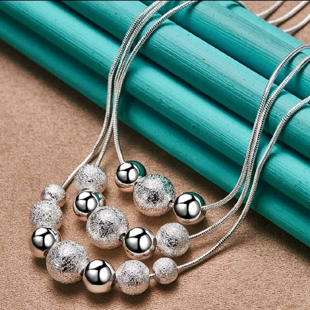 Elegant Silver Beaded Necklace with Textured Beads and Delicate Chain Design for Women's Fashion