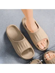 A pair of men's solid color fashion slides, lazy design, comfortable slippers, non-slip and lightweight, quick-drying material, suitable for indoor, outdoor and sports casual wear, Lightweight beach slippers