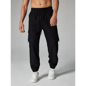 Men's Black Techwear Cargo Joggers Loose Fit Crinkle Fabric Streetwear Pants, Elastic Waist Utility Trousers, Y2K Cyber Style, Baggy Fit, Urban Outdoor Wear, Viral Mens Fashion, Oversized Techwear, Trending Outfit 2026 Alphabet Print Sweatpants polyester