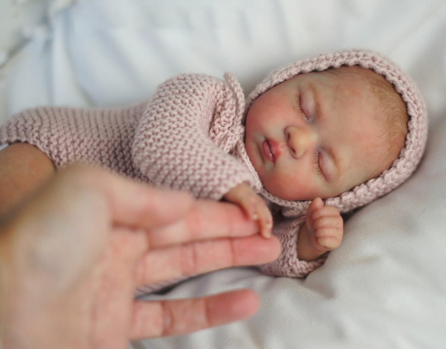 10" Realistic Reborn Baby Doll with Closed Eyes Soft Cloth Body & Vinyl Limbs Hand-Painted Head Handmade Lavender Knit Outfit Lifelike Newborn Doll Gift for Collectors