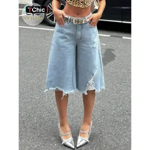 Women’s trendy ripped denim mid-thigh pants with an irregular hem—casual fashion jeans that are comfortable and stylish, perfect for everyday wear.