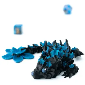 Mini Blossom Dragon | 7 inch 3D printed dragon with articulating links adorned with flower blossoms and flower pedals on the tail | Complete with boopable snoot
