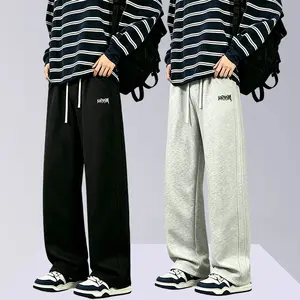 Men’s knit wide-leg athletic pants featuring an elastic waistband with drawstring, loose fit, casual pants with embroidered logo, comfortable breathable loungewear pants suitable for streetwear, gym, and everyday activities.