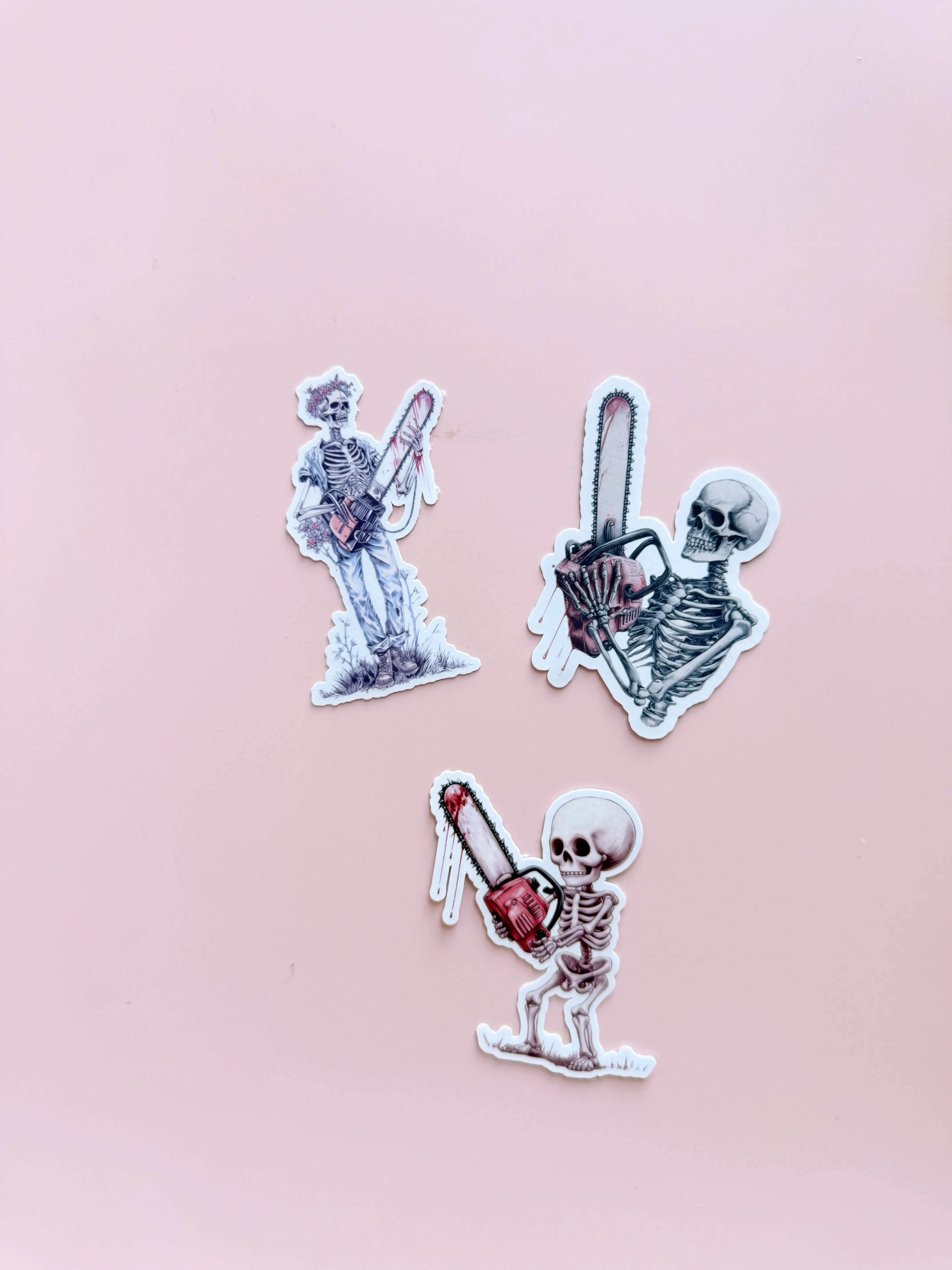 Skeleton Chainsaw Sticker Bundle | 3-Piece Horror Vinyl Decal Pack | Macabre Gothic Edgy Art | Spooky Halloween Laptop Water Bottle Stickers | Multiple Designs & Sizes