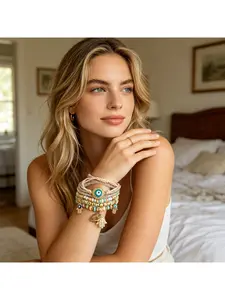 Six-piece Evil Eye Beaded Bracelet Set with Natural Gold Plating, Bohemian Hippie Charm, Layered Strand Bracelets in Blue, Ivory, Black Coral, Pink, and Black. Perfect for Christmas, Halloween, summer, winter, Valentine's Day, and New Year. An essential g