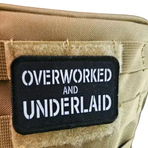 Overworked and underlaid 2"x3" removable morale patch with hook and loop backing black and white