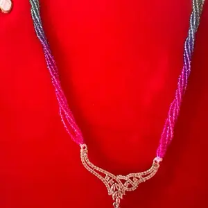 Hydro Crystal 8-10 Line Pote with AD Pendant - Detailed View of Necklace on Red Background