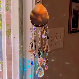 "Ocean Scraps" seashell with drilled holes and suspended pieces of broken accessories/ glass/metal/acrylic and glass accent crystals