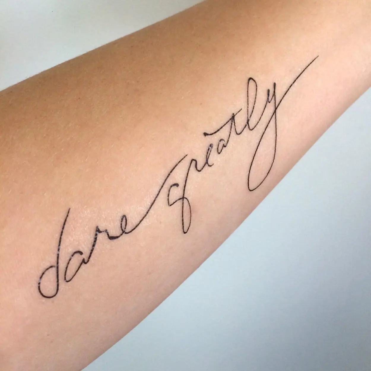 Dare greatly temporary tattoo script calligraphy cursive flowing text black simple minimal hipster pinterest teddy roosevelt brave strength